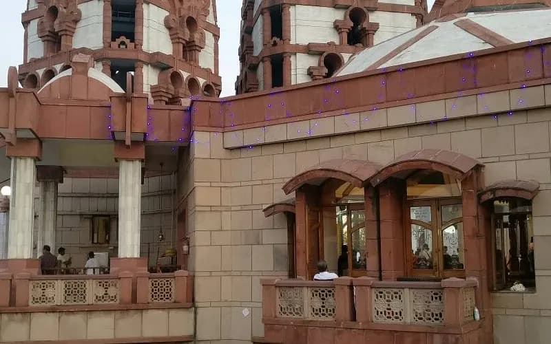 Red sandstone ISKCON temple with carved towers