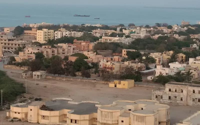 Okha town with cargo ships anchored offshore